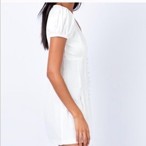 Cute white dress with plunging neckline